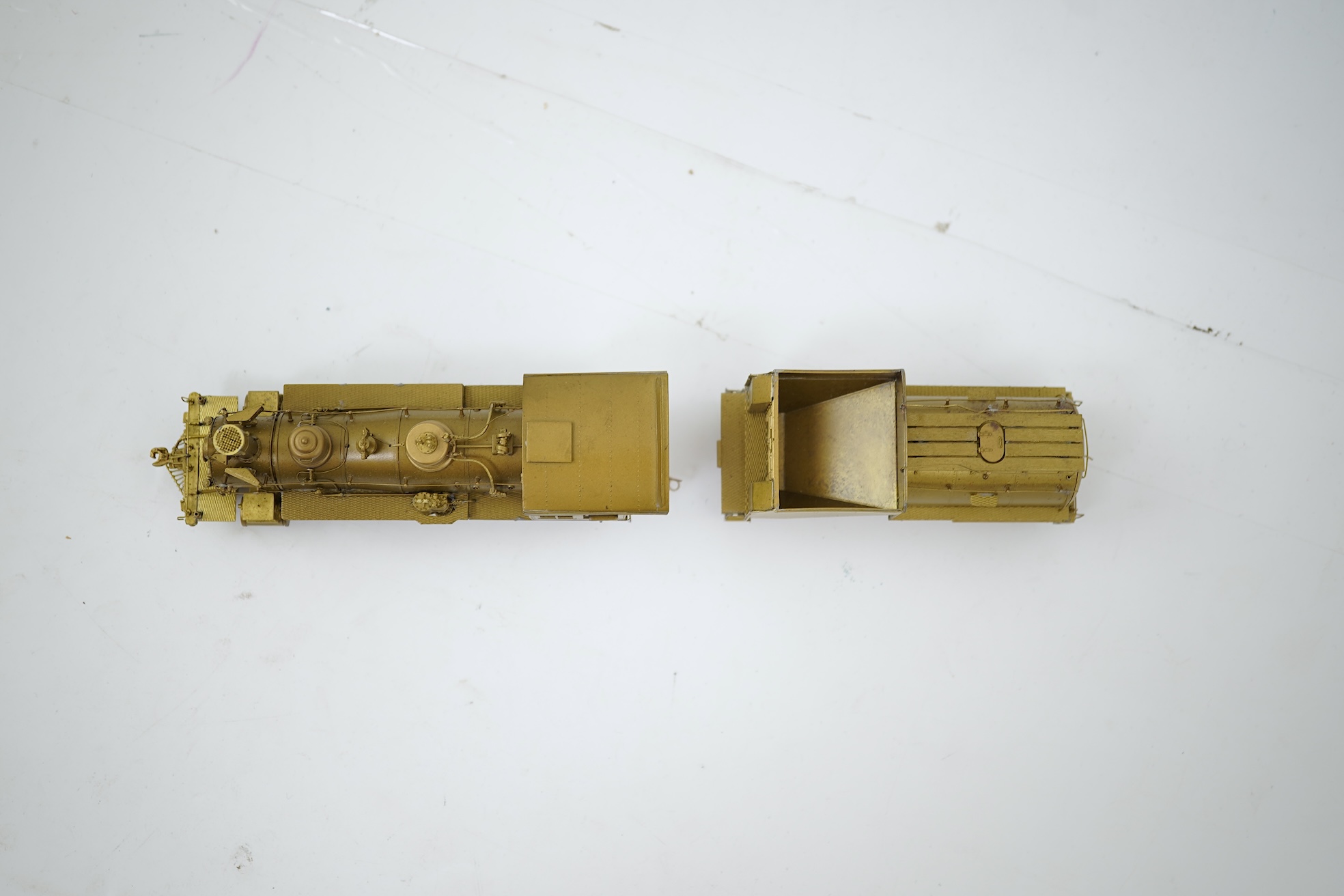 A boxed HO gauge Sunset Models unpainted brass model of Union Pacific 1242 4-6-0 locomotive with bogie tender, powered for two rail operation.
